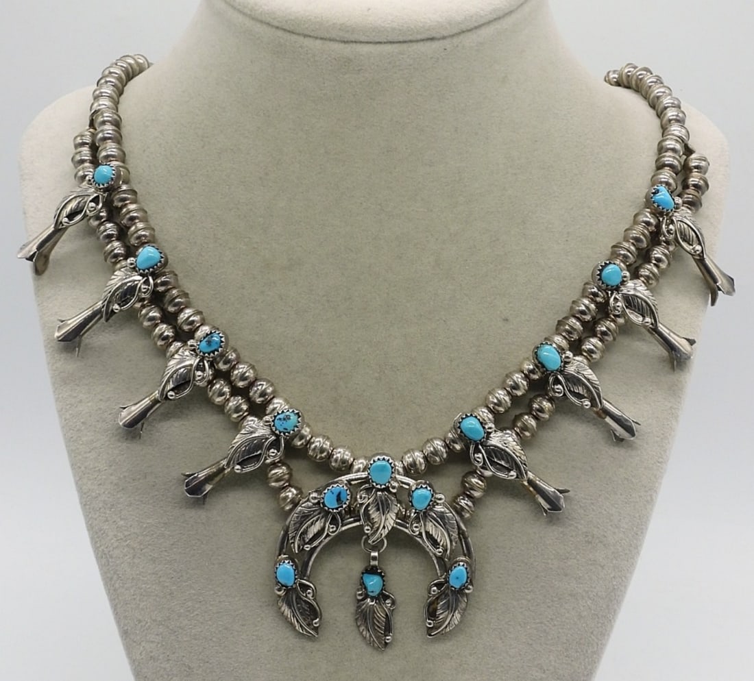 Squash Blossom 925 Turquoise Necklace: Squash Blossom sterling turquoise necklace, 22 inches long. Main pendant measures 2" x 2". Only marked "Sterling". (38 dwt)