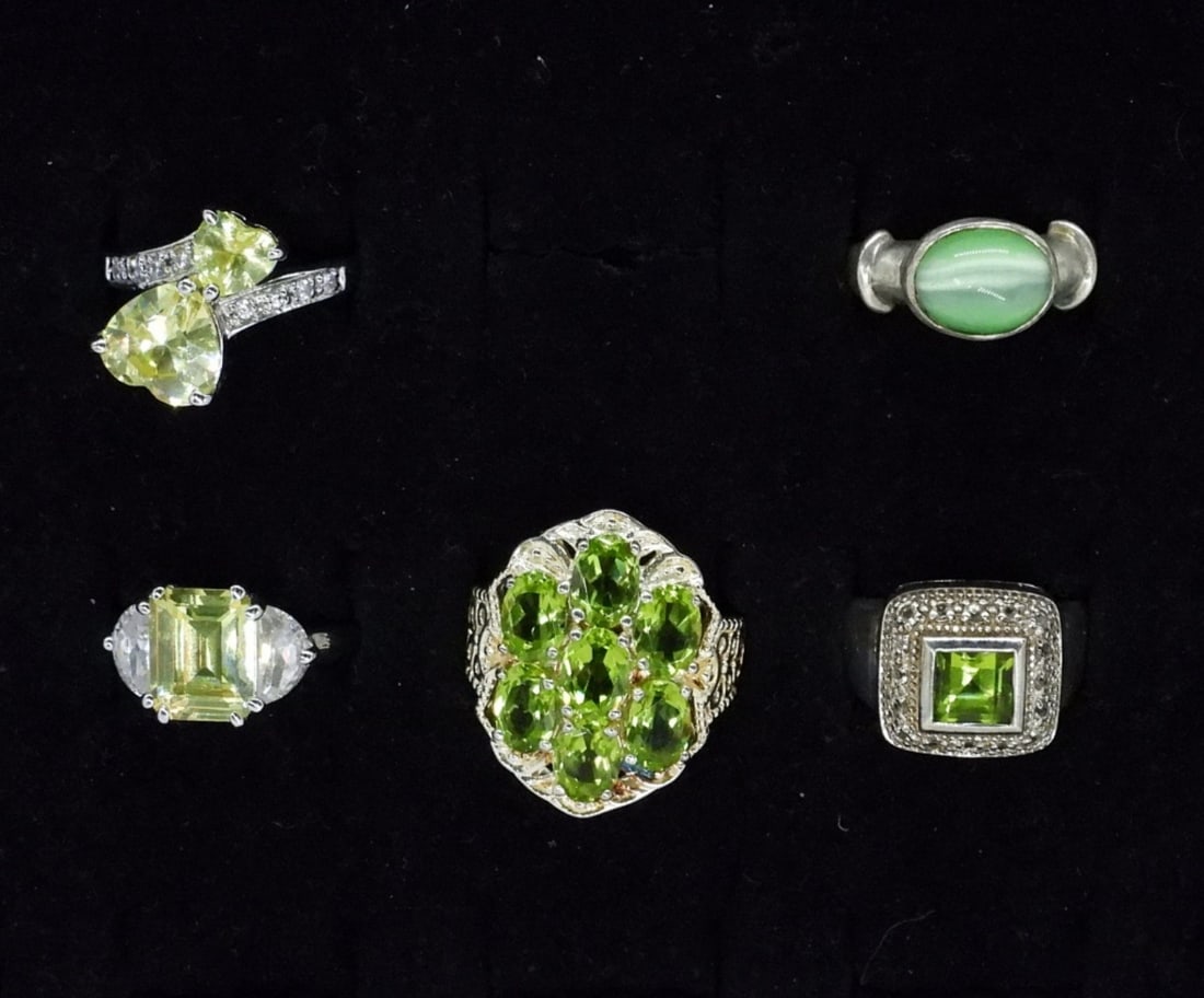 5 Sterling Peridot & Cats Eye Rings: Five sterling rings with peridot and green cats eye gemstones. Sizes are 6, 7 & 9. (16 dwt)
