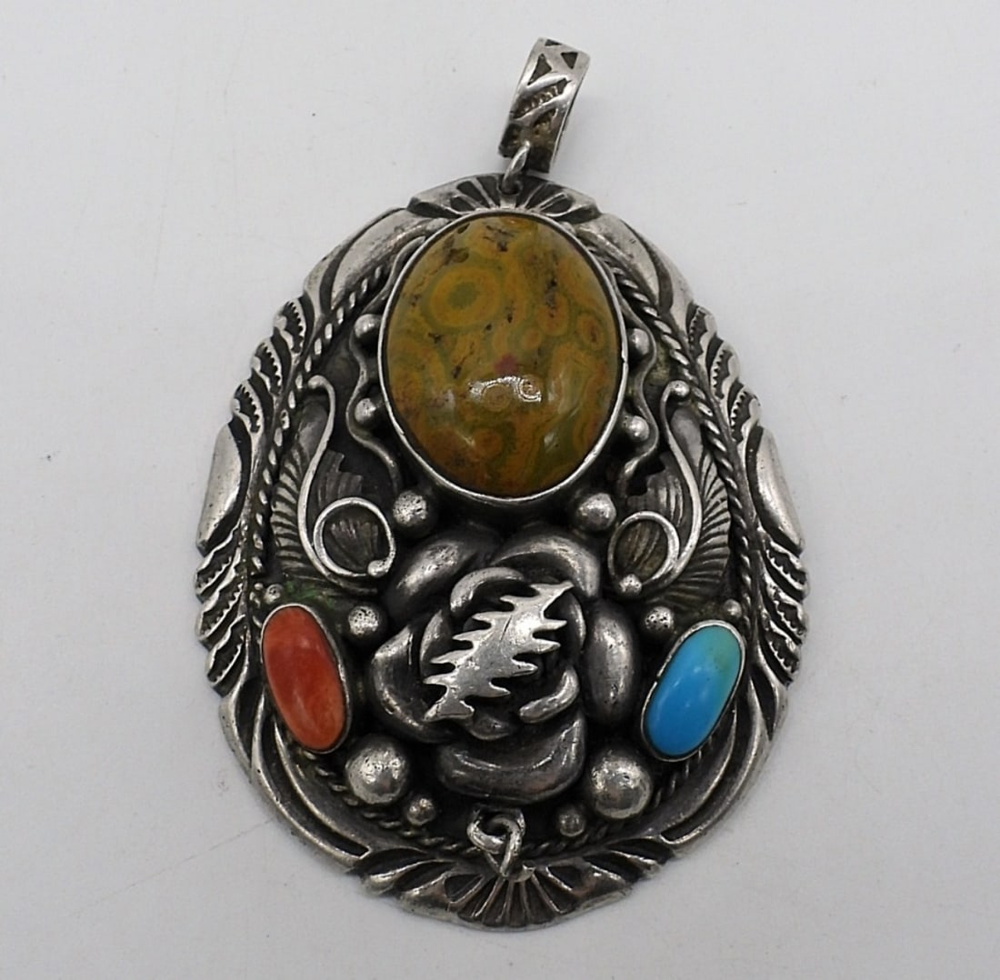 Large Jasper & Turquoise 925 Pendant: Large sterling pendant with Jasper, Turquoise and Red Coral gemstones. Pendant measures 3" long x 2" wide. (20.9 dwt)