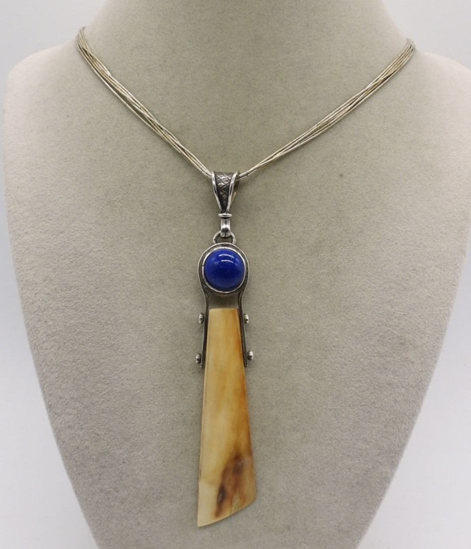 Lapis Lazuli & Bone Sterling Necklace: Lapis Lazuli and Bone sterling pendant, 4" long. On a 5 strand liquid sterling 18" chain. (11.3 dwt)