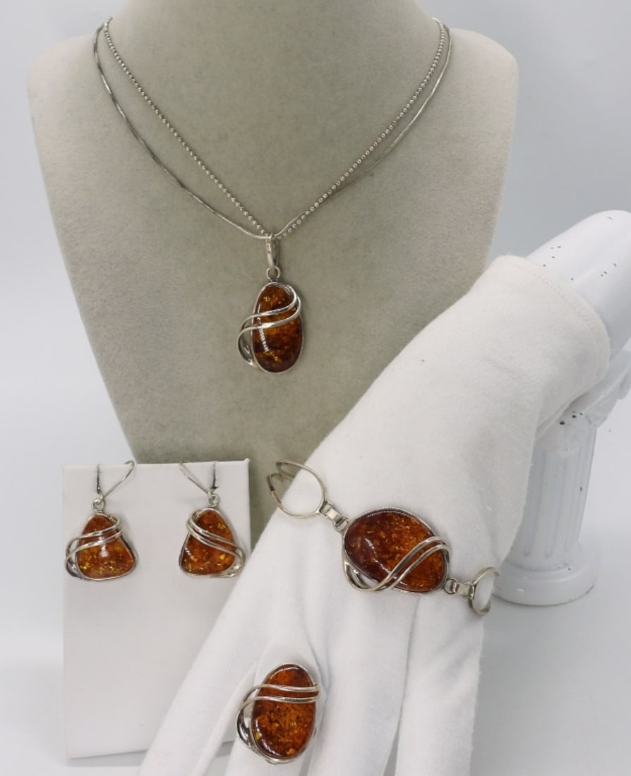 4 Piece Sterling Amber Set: Four piece sterling Amber gemstone set. Necklace is 20" long. Bracelet is 7" long. Ring size 7. Pierced earrings hang 2" long. (21 dwt)