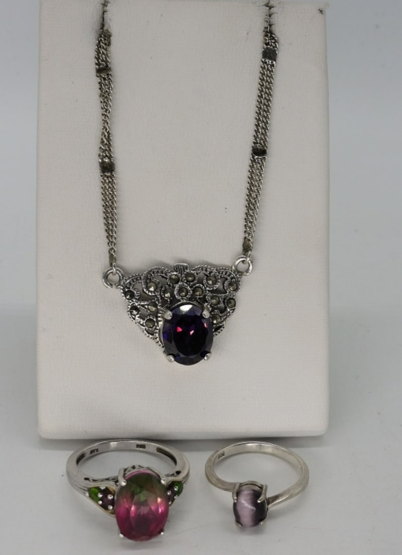 Amethyst, Tourmaline & Cats Eye Jewelry: Sterling Amethyst necklace, 24" long. Purple cats eye ring, size 6 3/4. Watermelon Tourmaline sterling ring, size 9. (12 dwt)