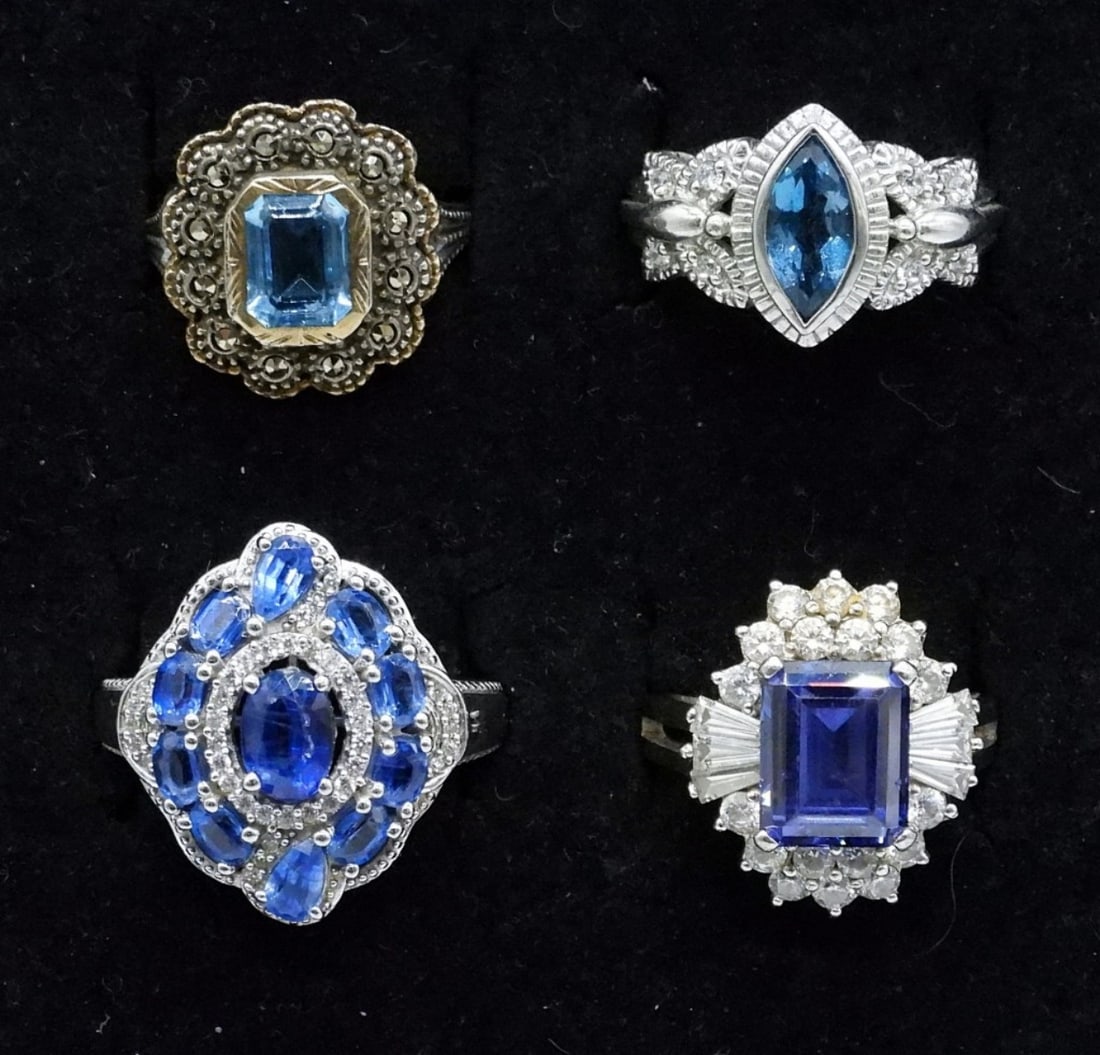 4 Sterling Blue Gemstone Fashion Rings: Four sterling, blue gemstone fashion rings. Blue Topaz and unidentified gemstones. Ring sizes are 7 & 8. (14 dwt)