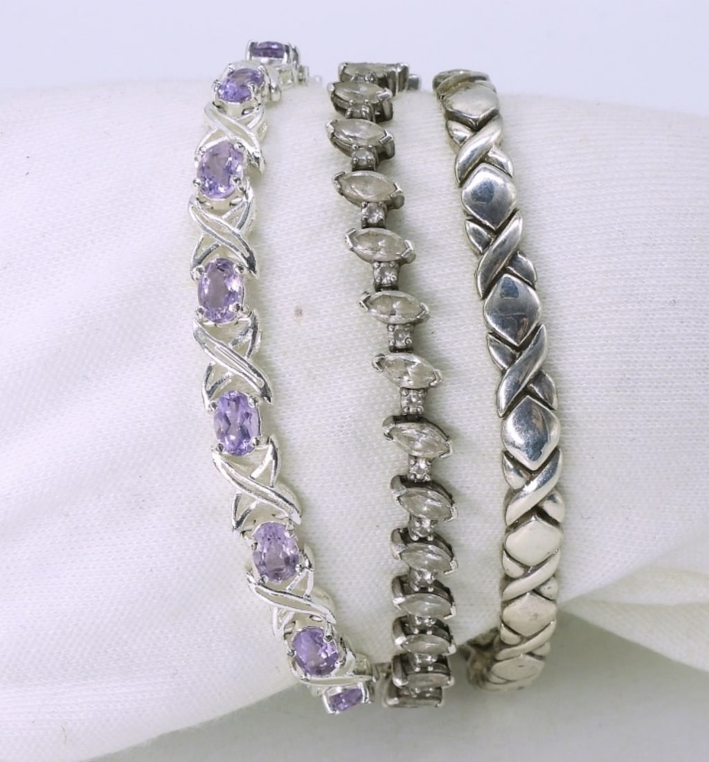 3 Sterling Fashion Bracelets - Amethyst: Three sterling bracelets. Amethyst, simulated diamond and vintage "xo". 7-7.5". (22 dwt) (6x4x2)