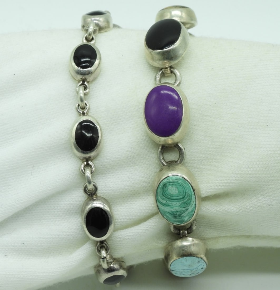 Taxco & Mexico Sterling Bracelets: Two sterling bracelets, various gemstones. Larger bracelet is Taxco "TJ-71", 7" long. Clasp sticks, but works. Smaller bracelet is Mexico 925, with black obsidian, 7.5" long. (32 dwt) (6x4x2)