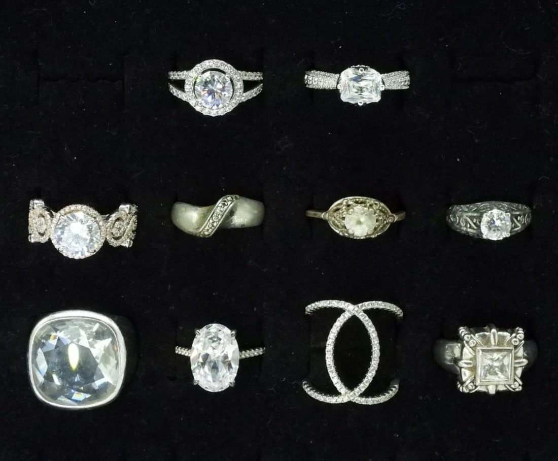 10 Sterling Bridal Style Rings: Ten sterling bridal style rings, simulated diamonds. Sizes 5.5 - 9. (36 dwt) 6x4x2