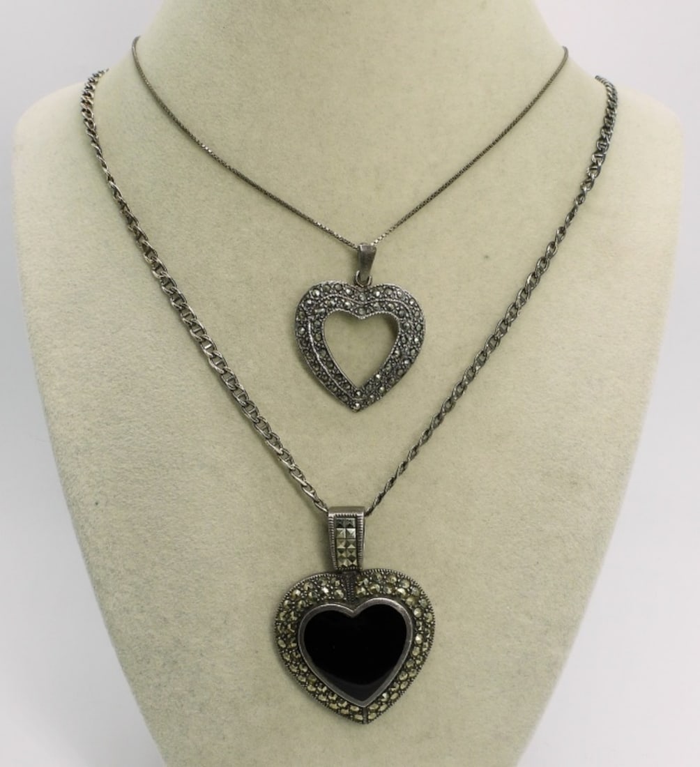 Black Onyx, Marcasite Sterling Necklaces: Two heart shaped sterling pendants on sterling chains. Black Onyx and Marcasite. 20" & 30" long chains. (20 dwt)