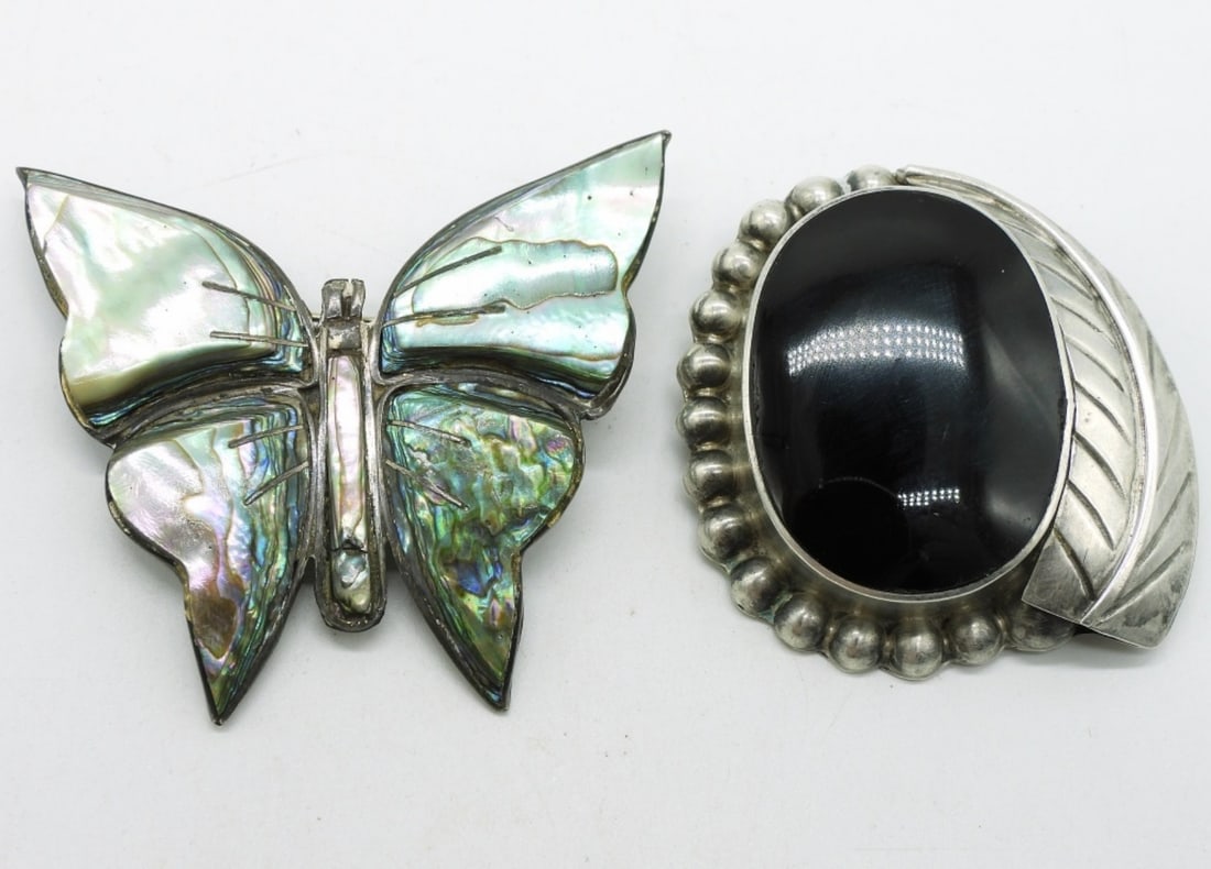 Taxco Black Onyx Brooch/Pendant & More: Taxco sterling brooch / pendant with a large black onyx gemstone. 1.5". (TD-46). Abalone butterfly sterling pin, 2" tall. (19 dwt)