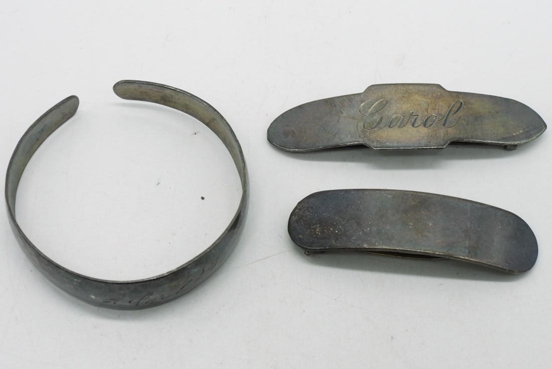 Antique Sterling Hair Clips & Bracelet: Two sterling antique hair clips (one engraved "Carol"), 2-2.5" wide. Sterling cuff bracelet (engraved "Carol") 6". (14.8 dwt) (6x4x2)