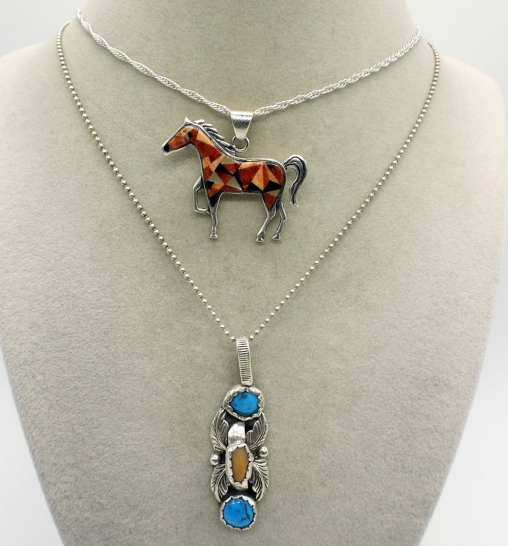 2 Sterling Native American Necklaces: Two sterling necklaces with Native American stamps on the backs of the pendants. Sterling chains 16" & 18" long. (10 dwt)