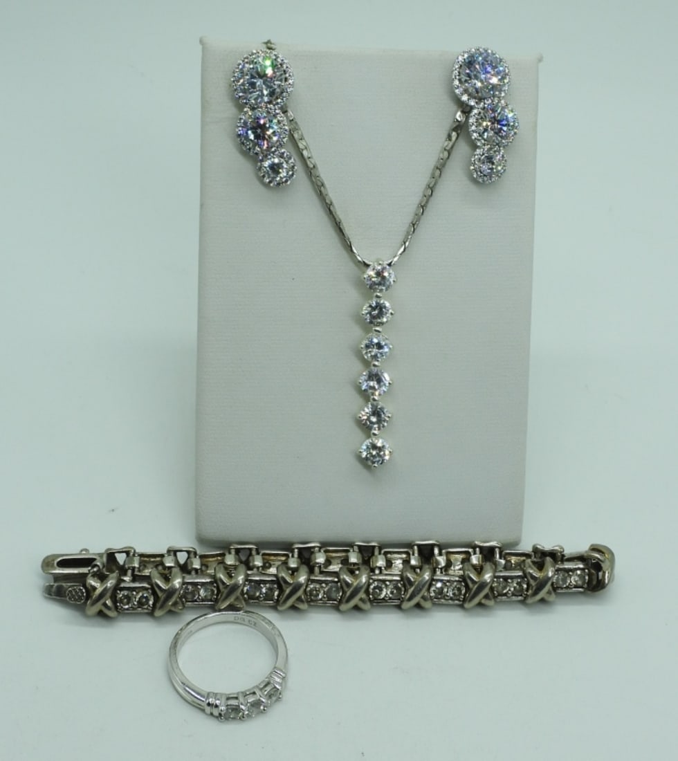 Bridal Style Sterling Set: Bridal Style, simulated diamond sterling set. Necklace is 24" long with 1.5" long pendant. Bracelet is 7" long. Ring size 6 and pierced earrings. (26 dwt) (6x4x2)