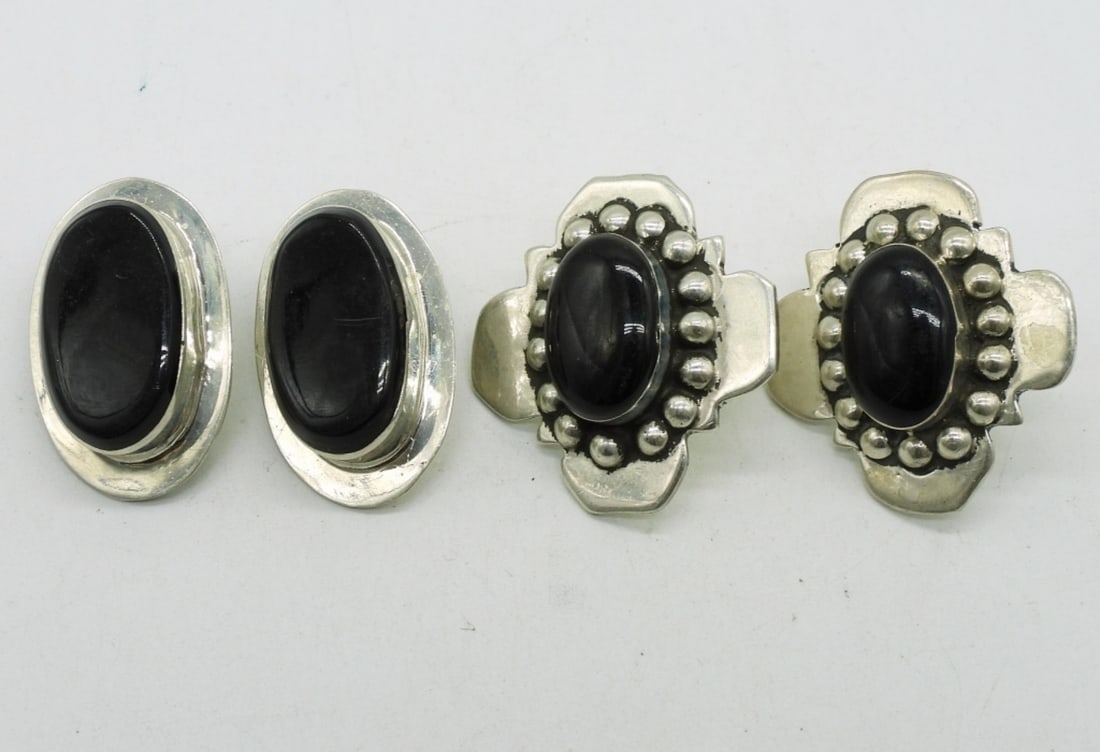Taxco Sterling Black Onyx Earrings: One pair of Taxco sterling pierced black onyx earrings, 1". Sterling clip on earrings with black onyx gemstones. (21 dwt) (6x4x2)