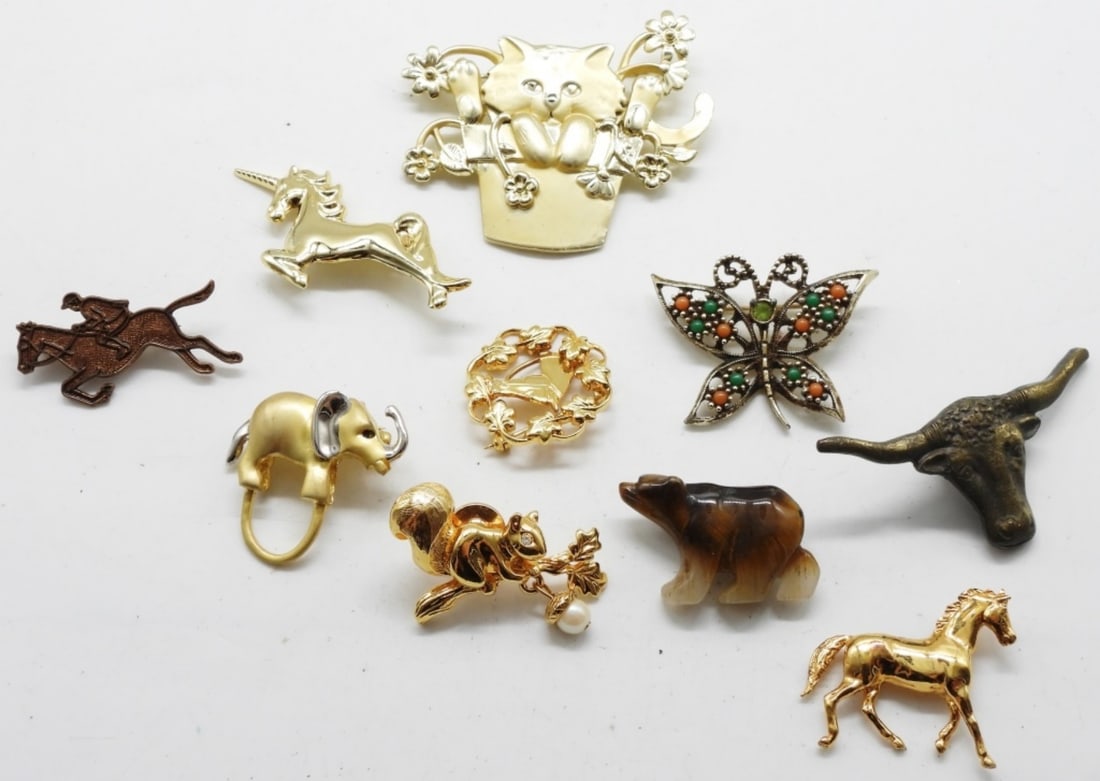 (10) Animal Brooches: If you love animals and brooches, this is your lot. Butterfly as a uranium stone.