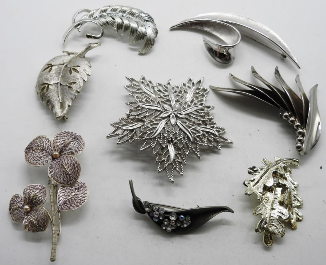 (8) Silver-Tone Brooches: All different styles. A Trifari and Kramer of New York brand are in this mix