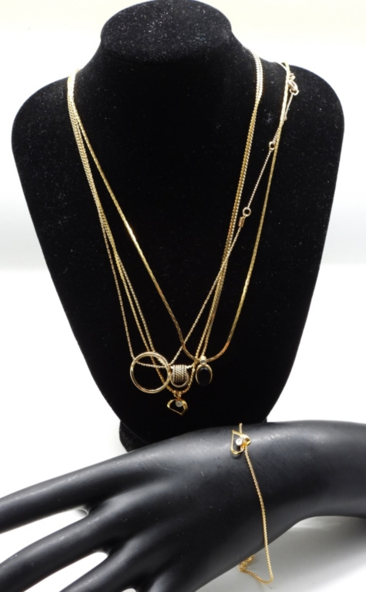 Gold Chains and Bracelet with Pendants: Follow us on Facebook, Instagram, X, and TikTok.