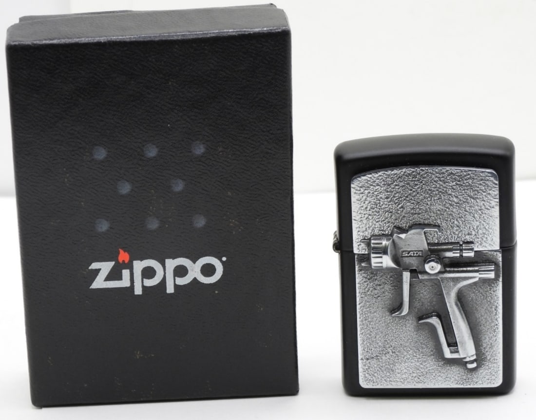 Sata Spray Gun Zippo 2023 Unfired: Unfired. Comes in its original box. Spray gun has a 3d effect on the top.