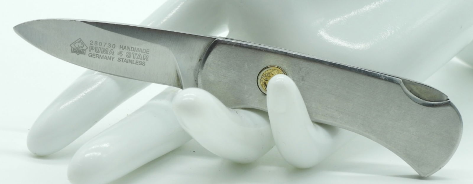 Puma 4 Star #280730 Lock-Back Pocket Knife: Silver handle lock-back pocket knife