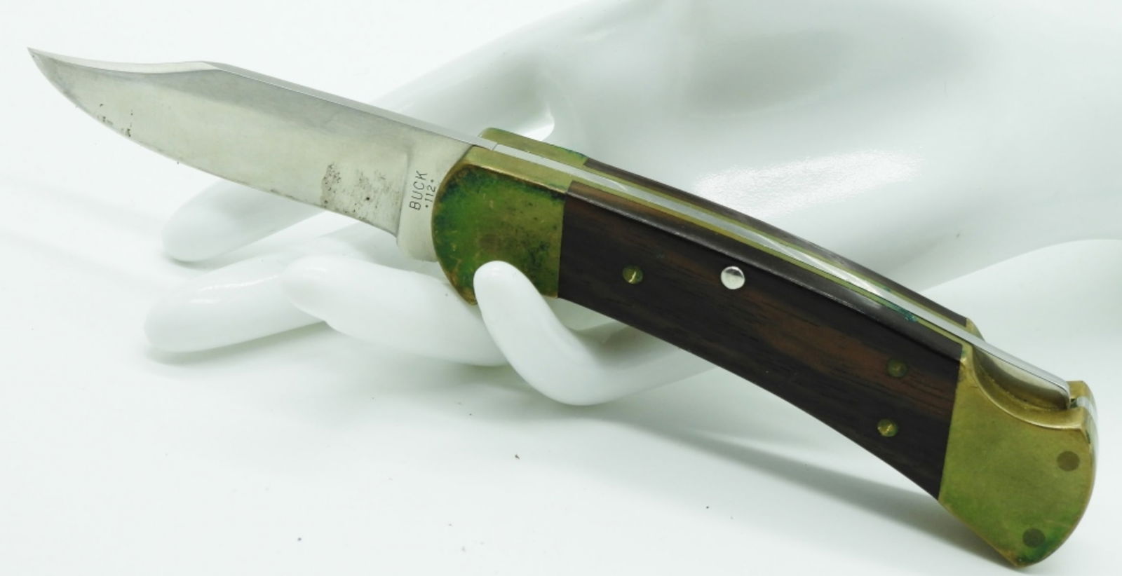 Buck 112 Lock-Back Pocket Knife: Very sharp with a wooden handle. Jylan 200 is etched on the handle