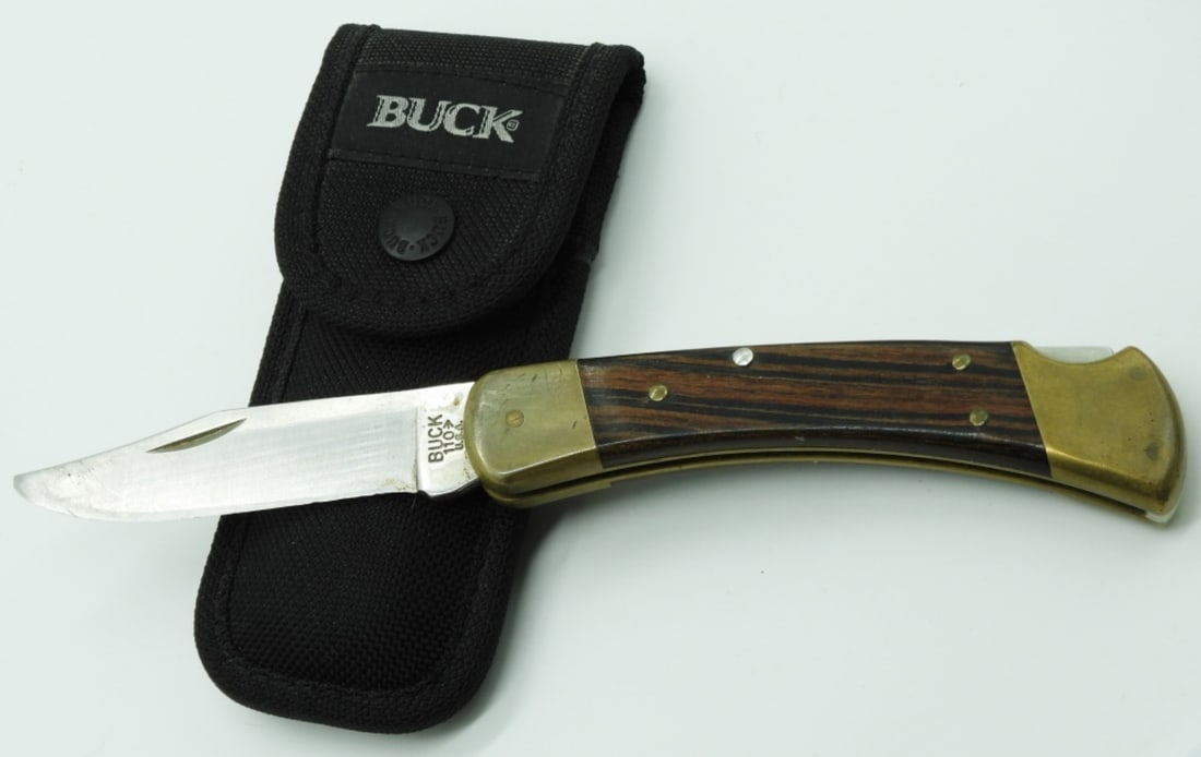 Buck 110 Lock-Back Pocket Knife: Used. Comes with a nylon sheath