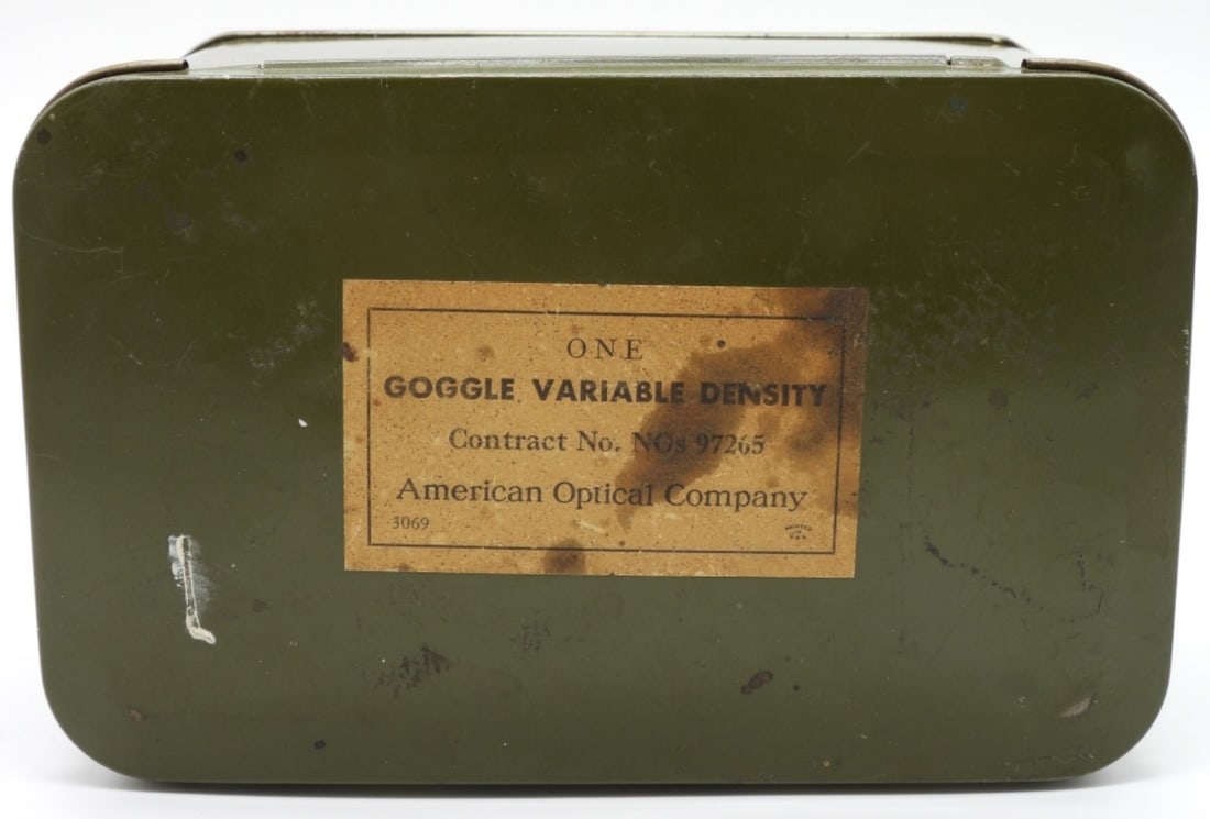Tin Only Goggle Variable Density: American Optical Company. Military green. This is just the tin.