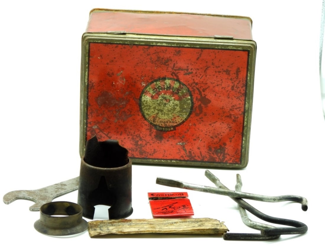 Primus Red Tin Box: Has a wrench & a few small tools. Smells like oil