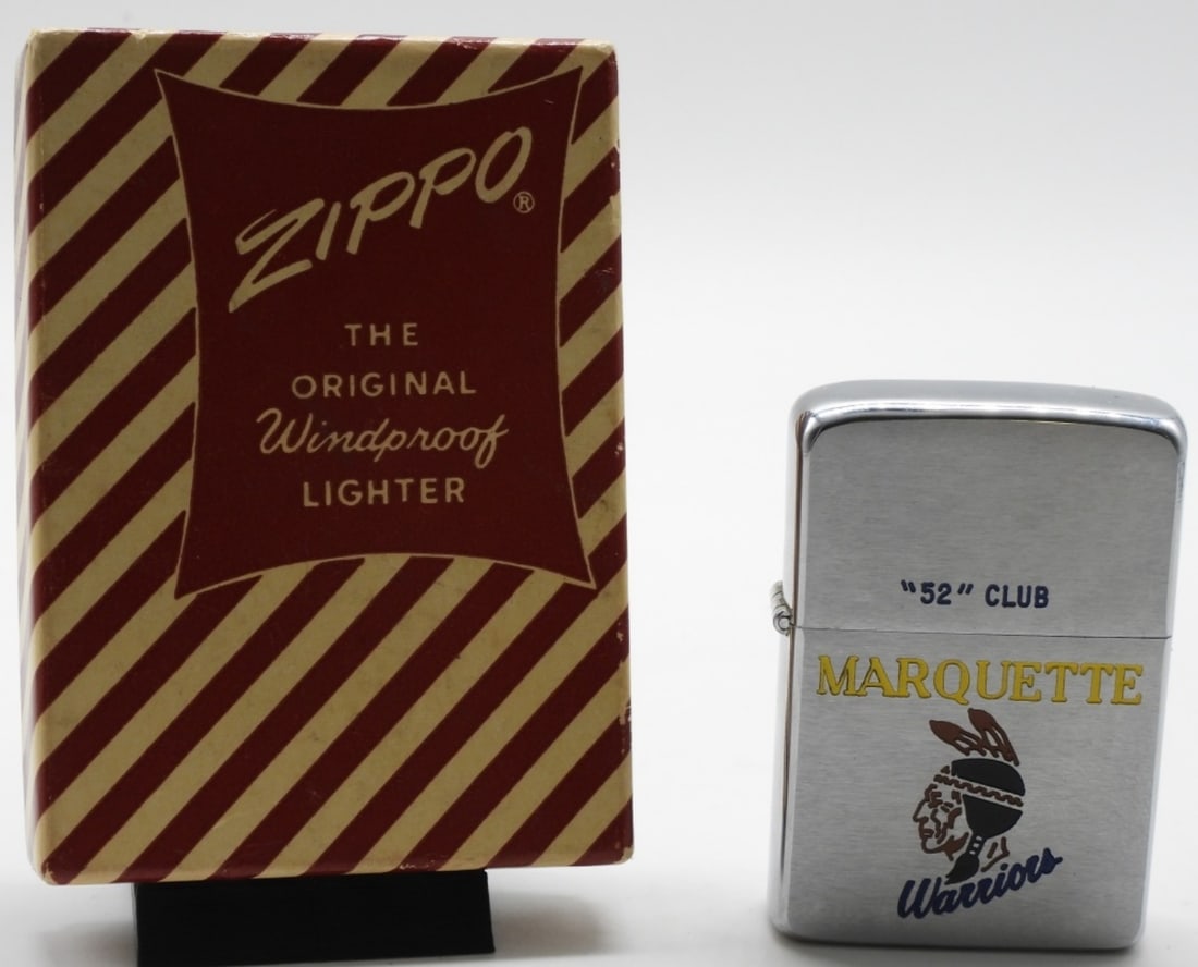 Pat. Pending 2517191 Marquette Warriors Zippo: Unfired. Comes with a red and white candy strip box. "52" Club. Marquette Warriors on the front. Engraved name on the back (see photos)