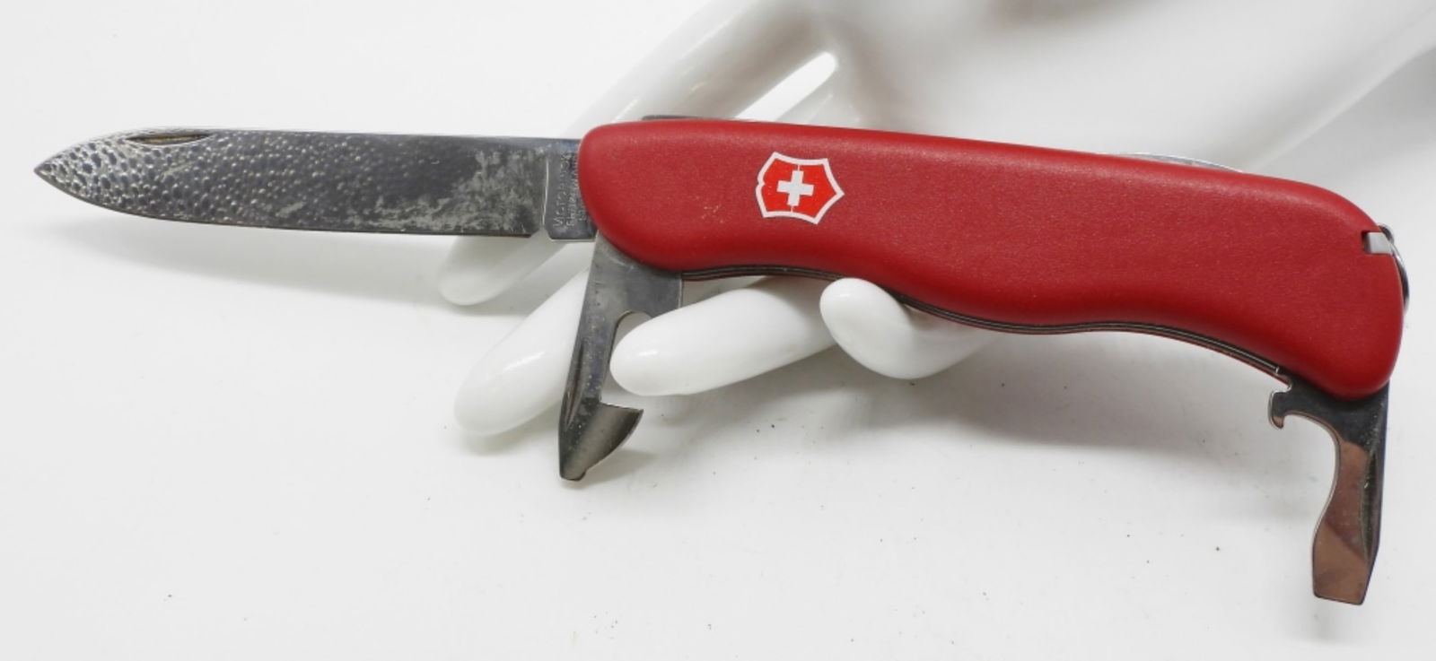 Victorinox Seven-Tool Swiss Army Knife: Longer in stature, still with the classic red, however, it has an easy grip handle