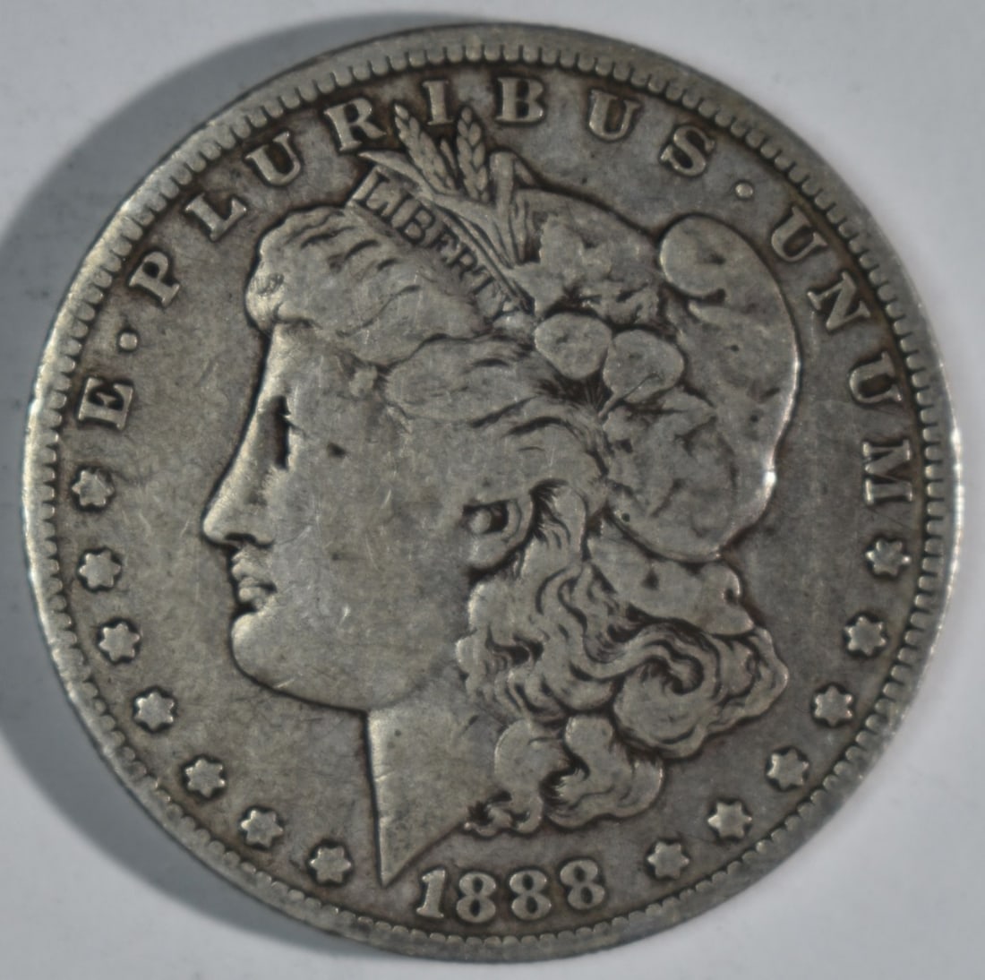 1880-O Morgan Dollar, Hot Lips: Follow us on Facebook, Instagram, X, and TikTok.