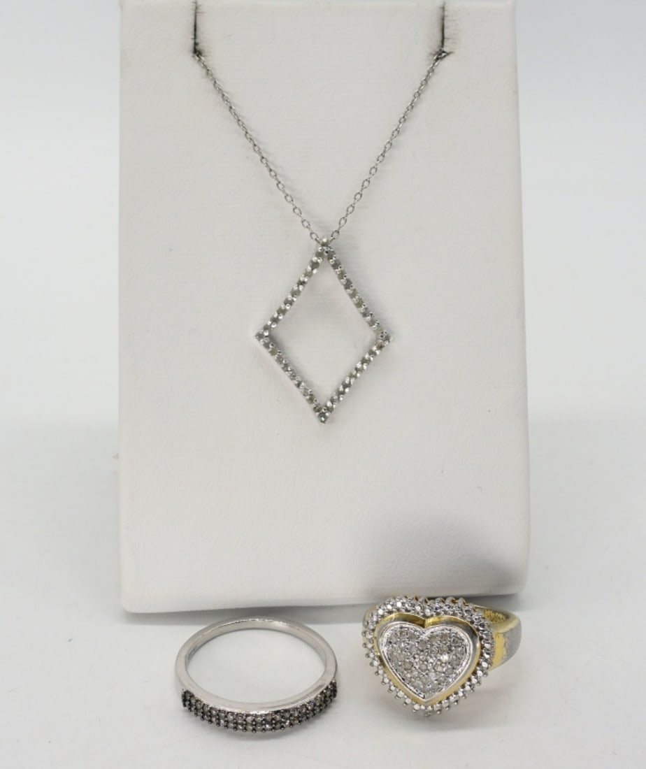Sterling Diamond Rings & Necklace: Sterling jewelry with Diamond gemstones (tested). The gold tone is coming off of the heart shaped ring. Ring sizes are 6 3/4 & 9. White & Champagne Diamonds. Sterling necklace with white diamonds, 18"