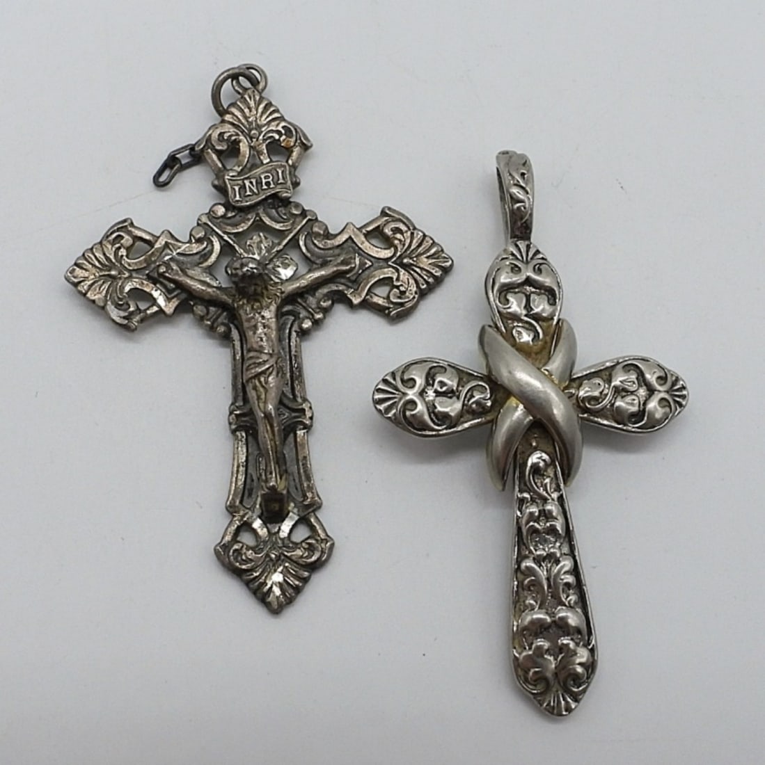 2 Sterling Religious Cross Pendants: Two sterling religious cross pendants, 2 1/4" long. (11.3 dwt)
