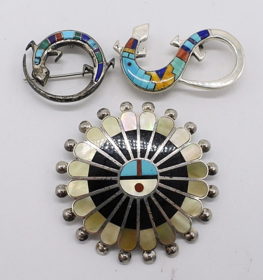 3 Sterling Zuni Gemstone Inlaid Brooches: Three sterling Zuni brooches. Turquoise, mother of pearl, black onyx and more gemstones. All 3 are also pendants. 1" & 2". (18 dwt)