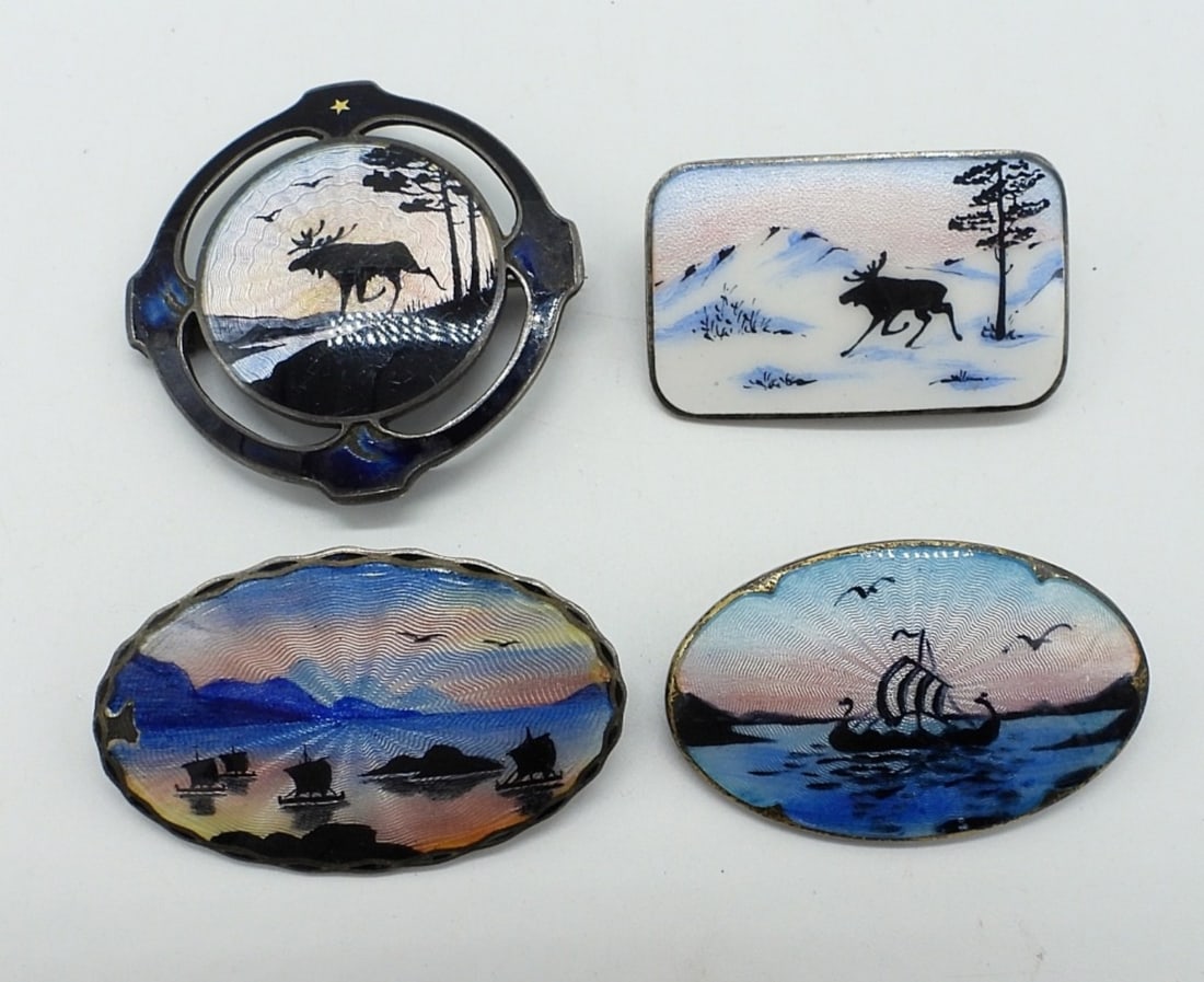 4 Norwegian Vintage Enamel Brooches: Four Norwegian vintage enamel brooches with Moose and Ship Designs. Markings include, Sterling, Norway & Norne. 1.5" wide. 1"-1.5" tall. (20 dwt)
