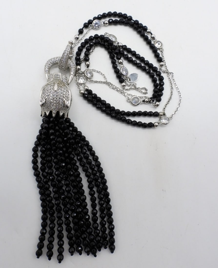 Black Spinel 925 Animal Fashion Necklace: Animal head covered in simulated diamonds with simulated ruby eyes. Black spinel beads on the chain and hanging from the pendant. Only markings are "JRSS 925". Pendant is 4.5" long. Chain is 32" long.