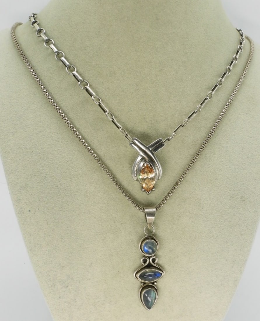 Peach CZ & Moonstone 925 Necklaces: Two pretty sterling necklaces, 20" & 24" chains. Peach Cubic Zirconia, 1" pendant and a 2" Moonstone pendant. (18 dwt)