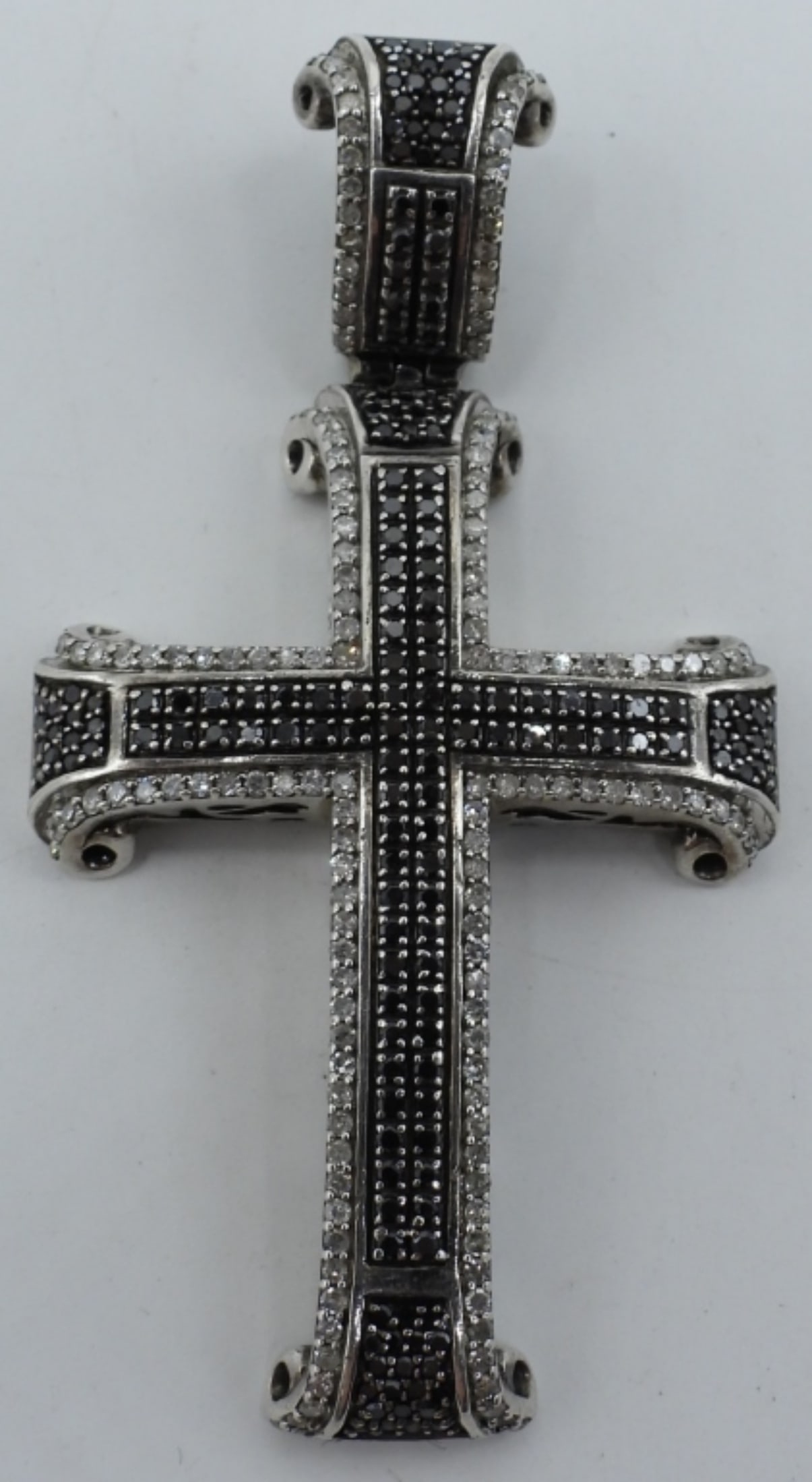 Black & White Diamond 925 Cross Pendant: Black and White Diamond, Sterling cross pendant, 2.5" tall and 1.5" wide. Diamonds were tested. No total carat weight available. (7.6 dwt)