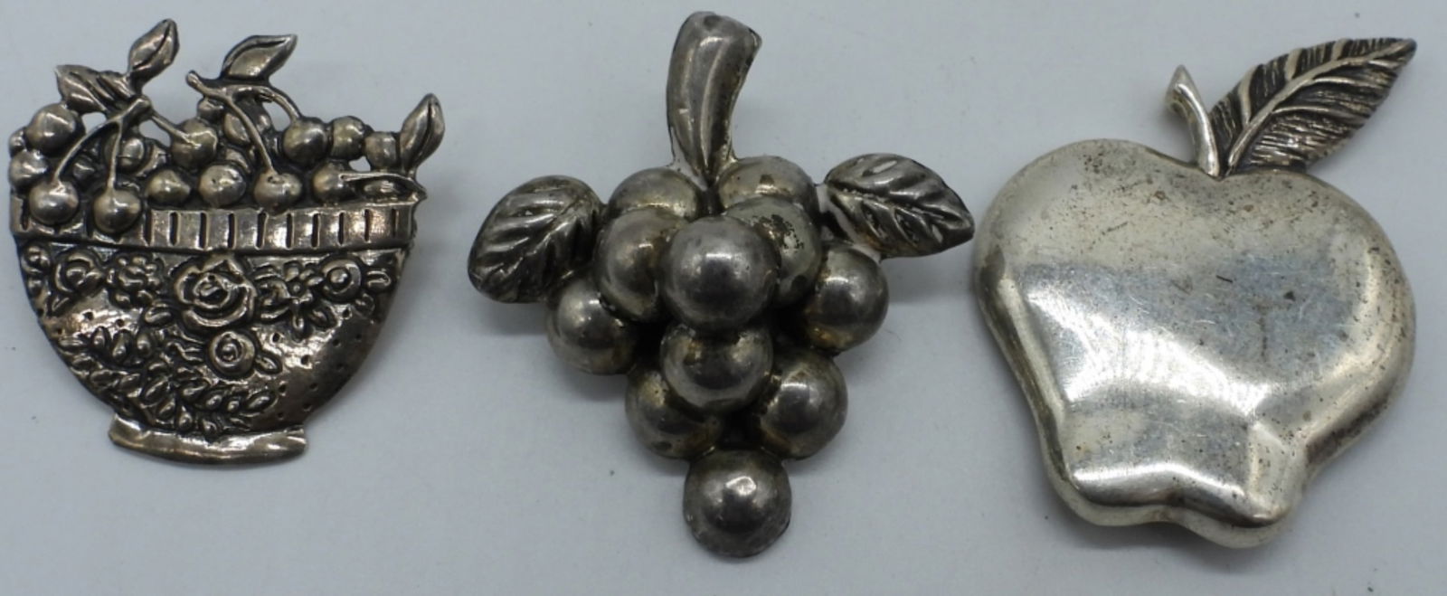 3 Vintage Sterling Brooches: Three vintage sterling brooches, 1" -2" long. (13.1 dwt) (6x4x2)