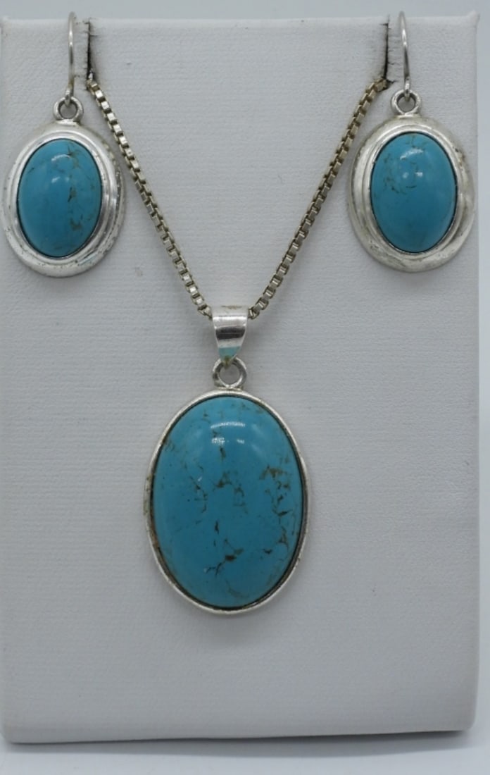 Matching Sterling Turquoise Necklace Set: Matching sterling necklace and pierced earrings with turquoise gemstones. Necklace is 20" long. Earrings hang 1 1/4". (9 dwt)