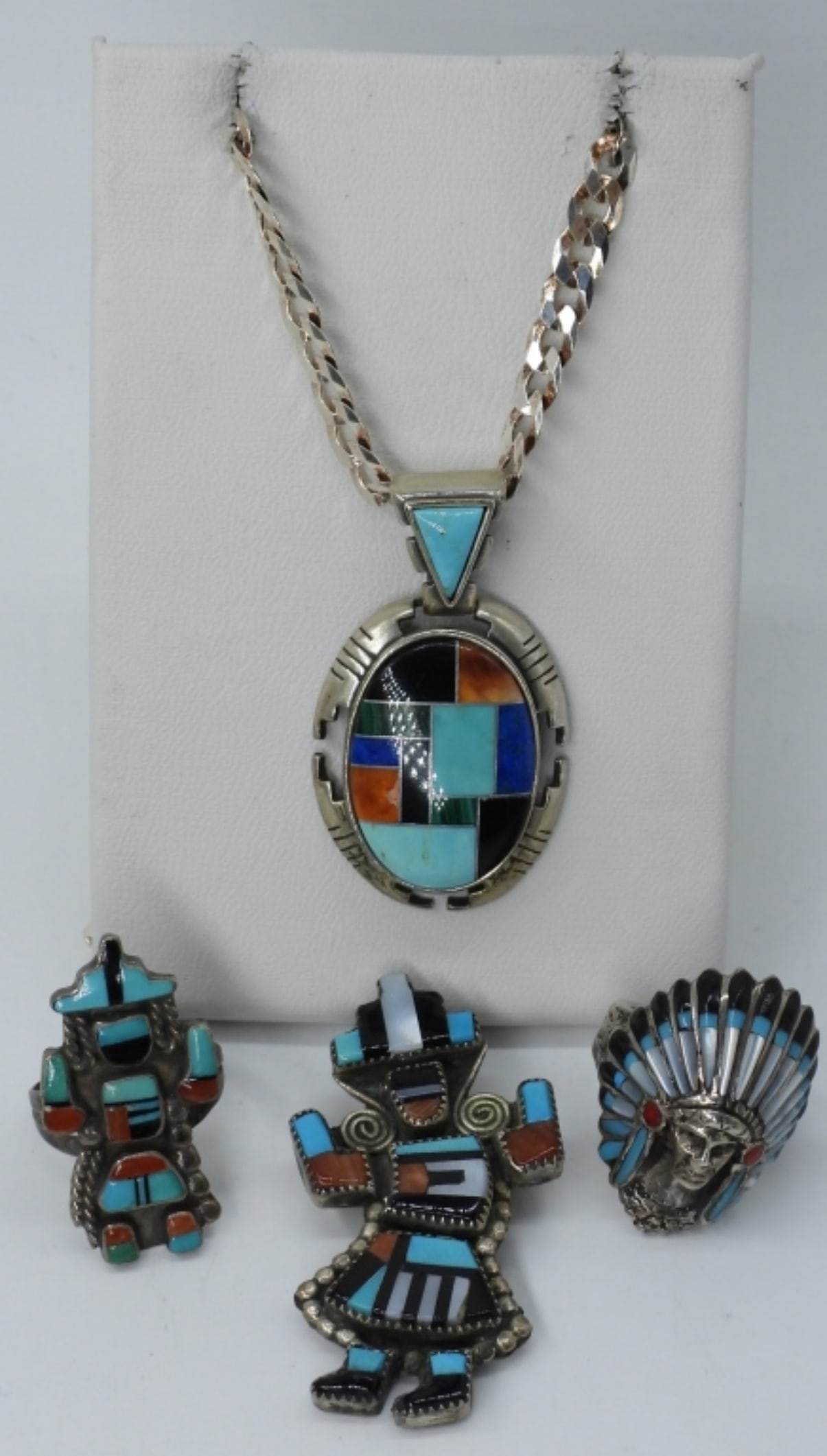4 Navajo Zuni Sterling Rings, Necklace, Pin: Two sterling rings with black onyx, turquoise and mother of pearl gemstones. Sizes 4.5 & 5. Necklace is 20" long. Pin is 1 3/4" long. (21 dwt)