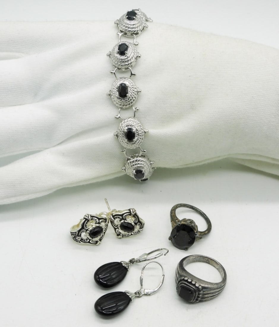 Black Gemstone 925 Rings, Earrings, Bracelet: Black Onyx or Spinel sterling jewelry. Bracelet is 8". Two pair of pierced earrings. Two rings, sizes 5 & 6.5 (28 dwt) (6x4x2)