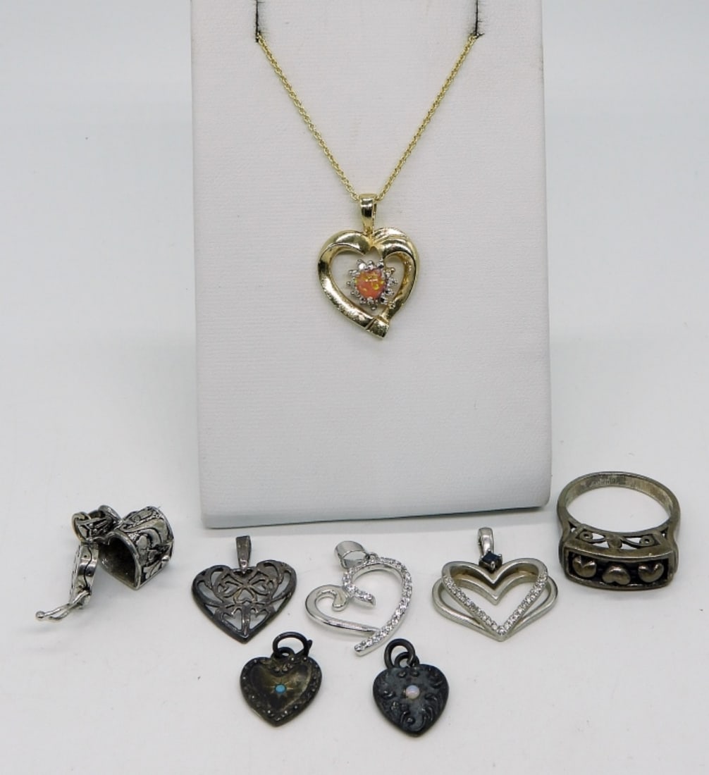8 Pieces of Sterling Heart Shaped Jewelry: Six loose sterling heart shaped pendants. Gold tone sterling heart pendant on a gold tone 925 chain, 18" long. Ring, size 7. (14 dwt)