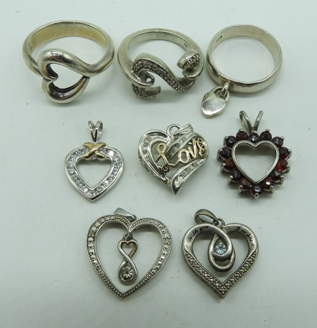 Heart Shaped 925 Pendants and Rings: Three sterling rings, sizes 7, 8, 10. Five sterling heart shaped pendants with gemstones. (19 dwt)
