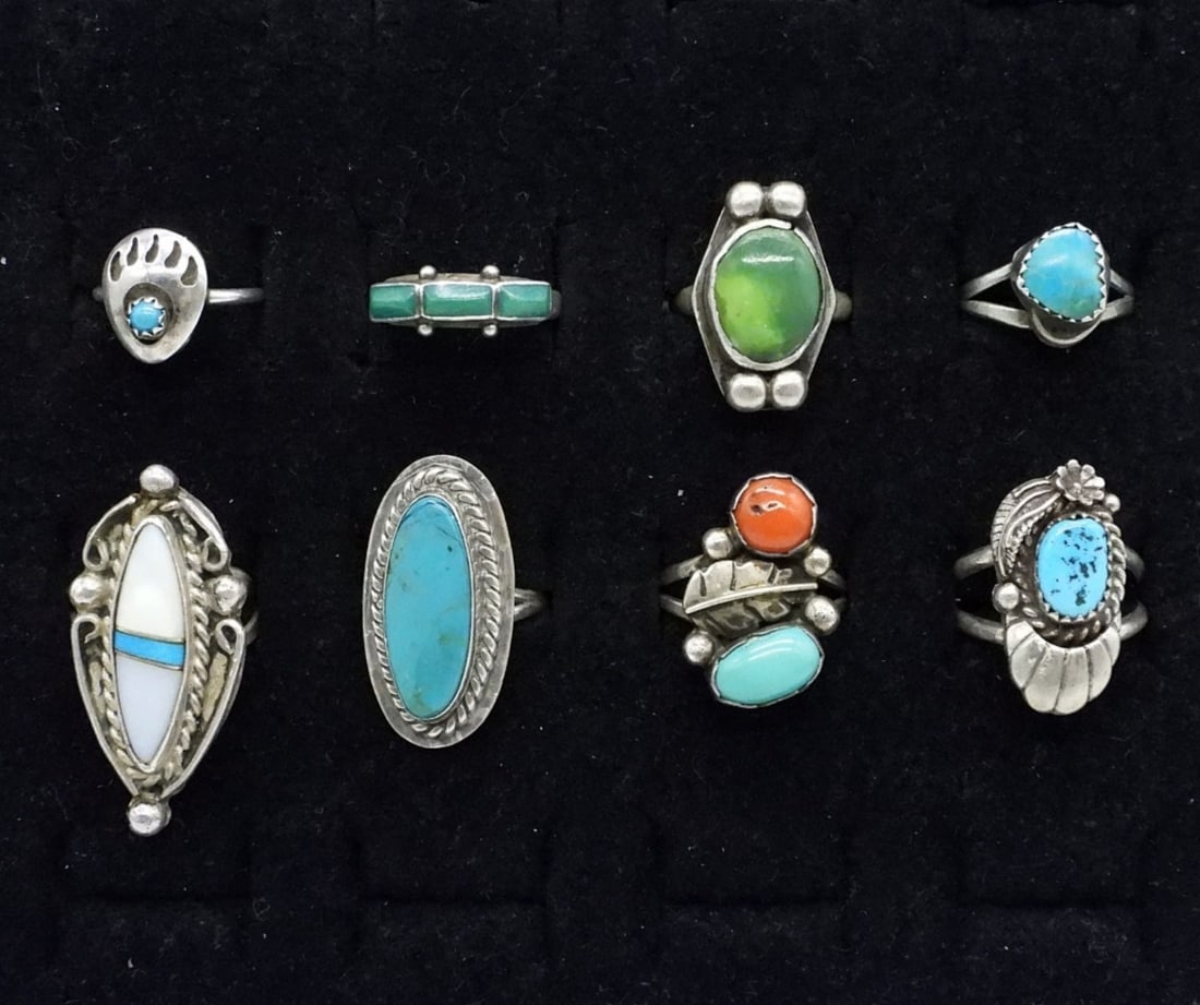 8 Sterling Turquoise Fashion Rings: Eight sterling fashion rings with turquoise, red coral and mother of pearl gemstones. Sizes 3.5 - 7. (20 dwt)