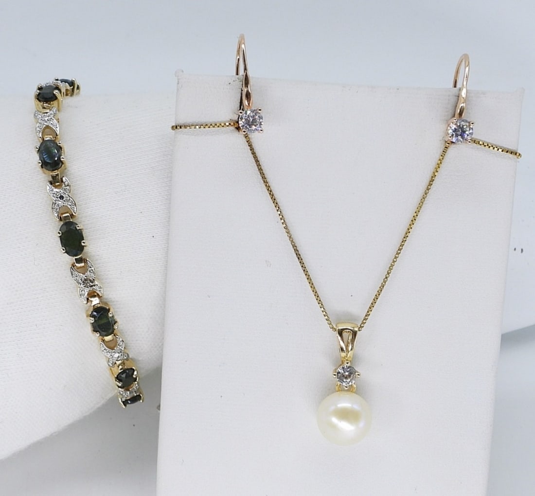 Beautiful Gold Tone Necklace, Bracelet & More: Beautiful gold tone sterling bracelet with gorgeous dark green gemstones, 7" long. Gold tone sterling pearl necklace, 18" long. Pierced earrings. (10 dwt)