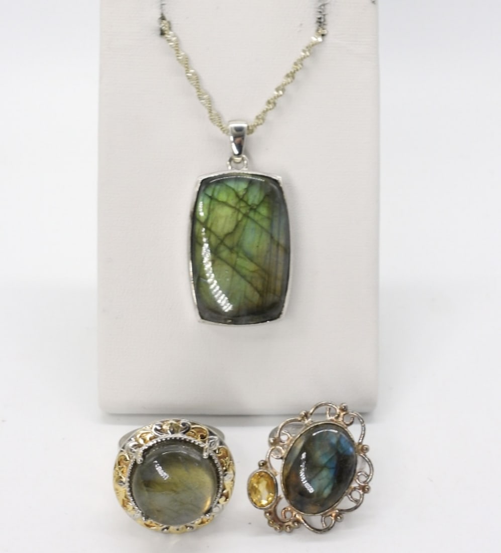 Sterling Labradorite Rings and Necklace: Two sterling labradorite gemstone rings, size 8. Labradorite sterling pendant (seems to be missing some sort of backing), 1.5" long. Sterling chain is 24" long. (20 dwt)