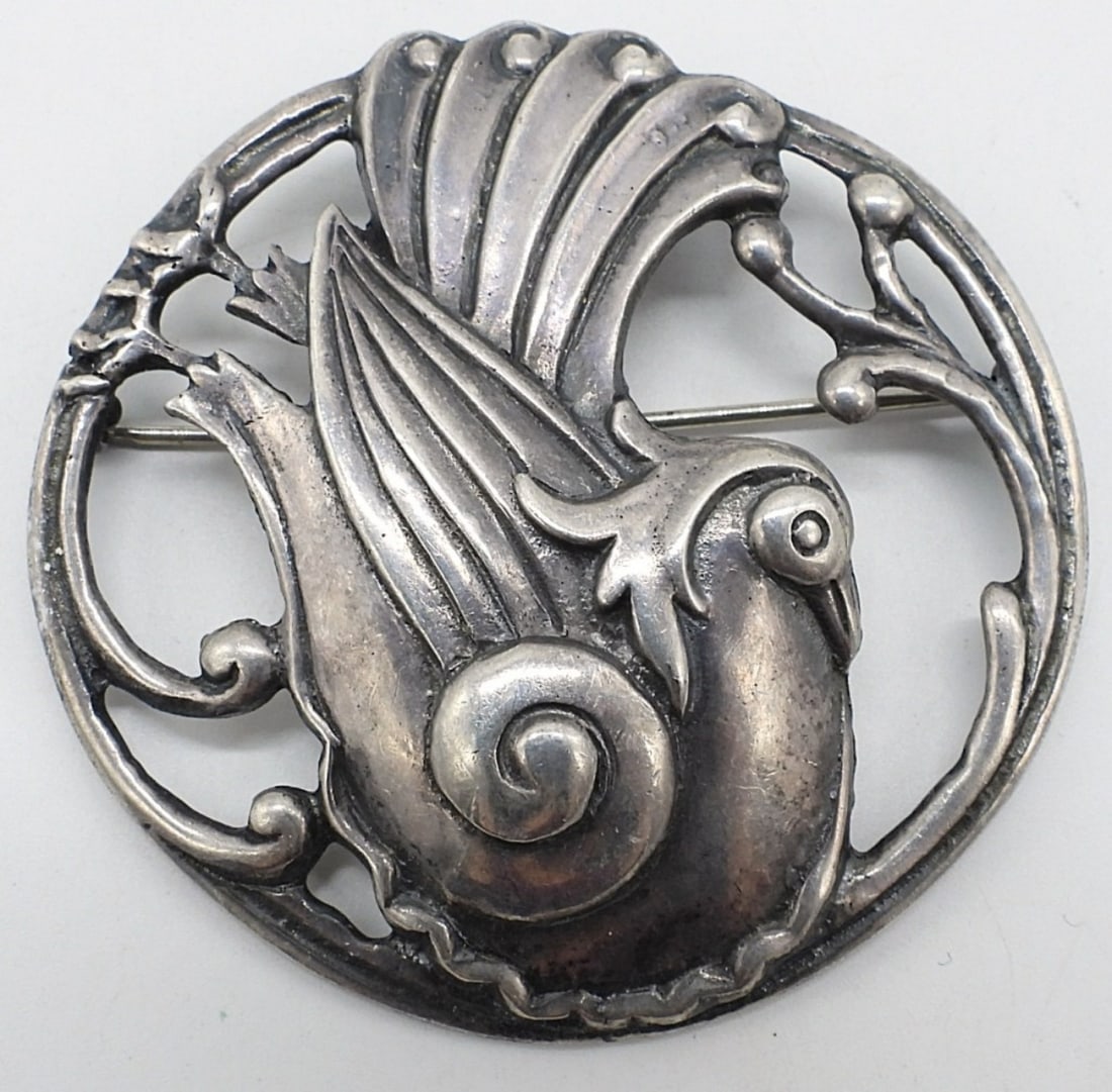 Tabby Brand Sterling Bird Brooch: Tabby brand, large sterling brooch with a sitting bird brooch, 2.5". (18.6 dwt)