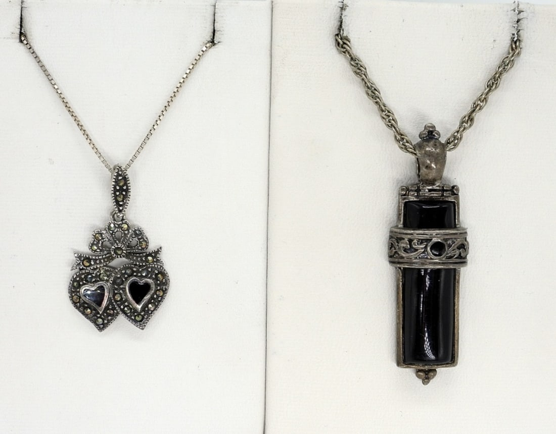 2 Sterling Black Onyx Necklaces: Two sterling necklaces with black onyx pendants, 18" & 24" long chains. (13 dwt)