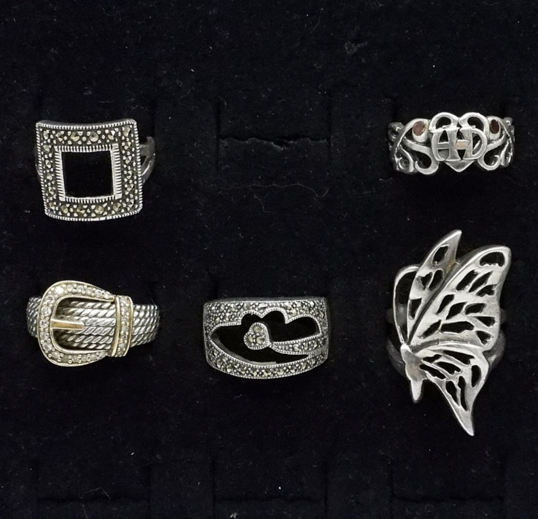5 Sterling Fashion Rings: Five sterling fashion rings, sizes 5.5 - 8. One Harley Davidson ring, with stamp inside. (17.5 dwt)