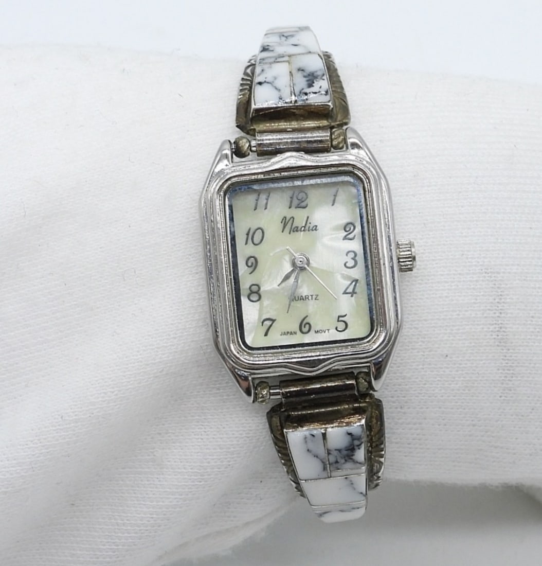 Navajo White Buffalo Turquoise Watch: Navajo (signed SF) watch band with White Buffalo Turquoise. Stretchy band with a "Nadia" brand watch face, mother of pearl face. Watch has not been tested as to working or not! 5.5" band