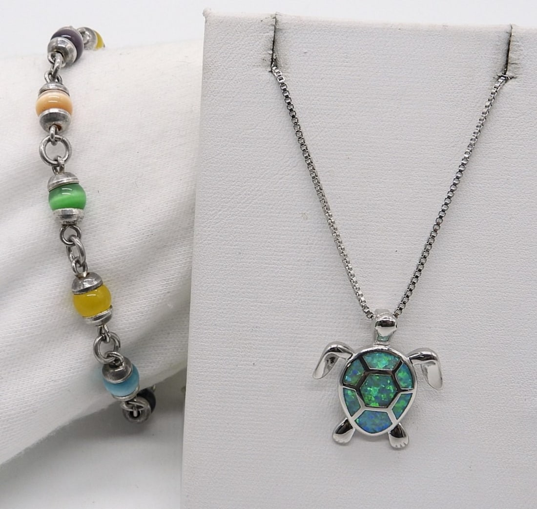 Cats Eye and Opal Sterling Necklace & More: Sterling multi colored Cats Eye Bracelet, 8" long. Sterling turtle pendant with opal inlay, 1". On a 18" sterling chain. (10 dwt)