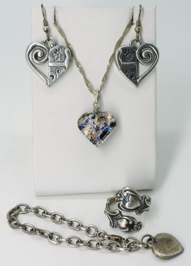 Heart Shaped Sterling Earrings, Ring & More: Sterling heart shaped jewelry. Necklace is 24" long. Bracelet is 6" long. Pierced earrings hang 1.5" long. Ring is size 6-7, adjustable. (16.6 dwt)